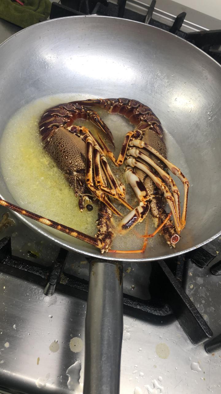 Lobster being prepared in the kitchen at Sol Bar Restaurant