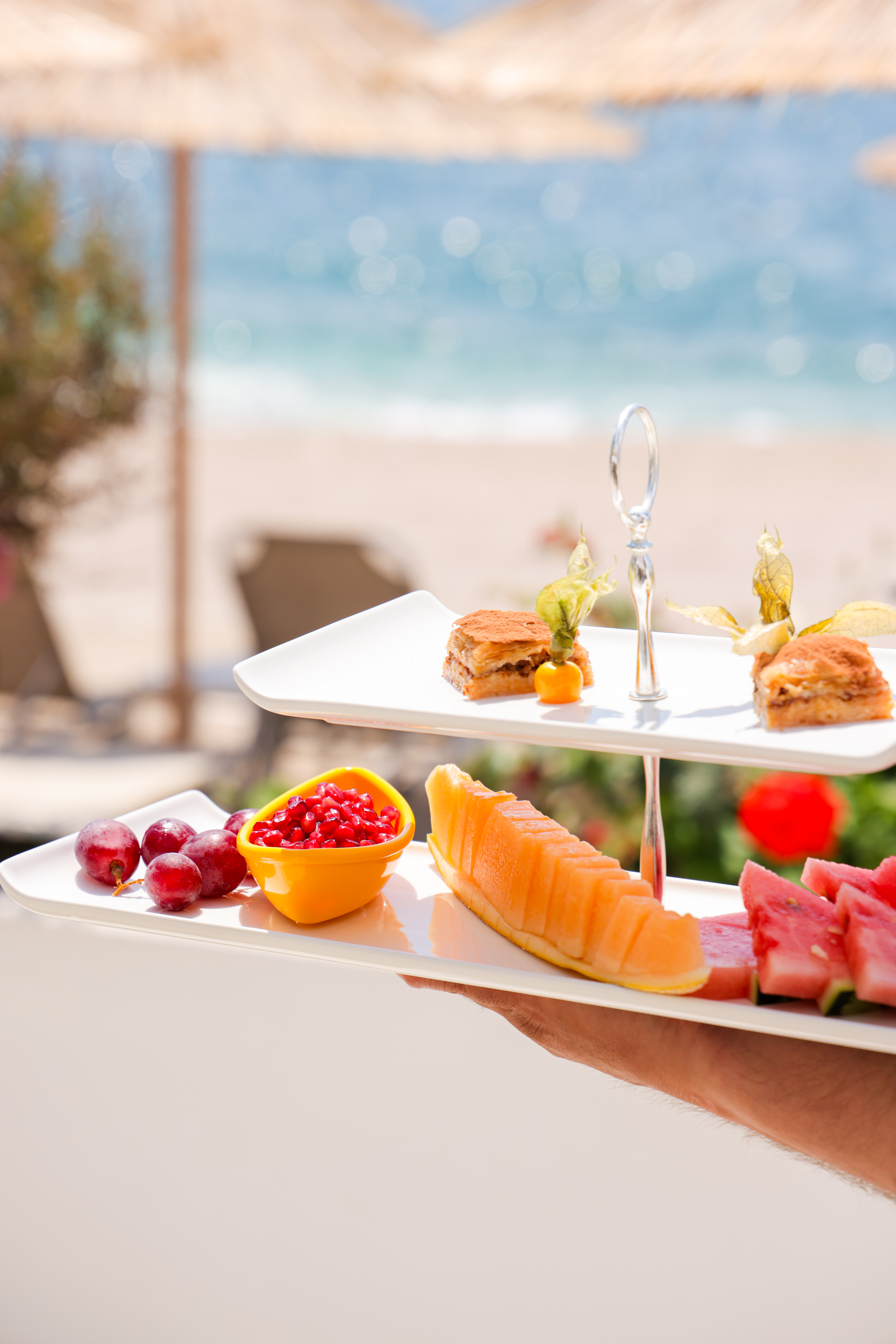 Fruit and baklava platter on the beach